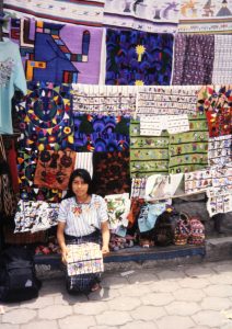 indigenous-woman-selling-native-crafts-near-atitlan-guatemala